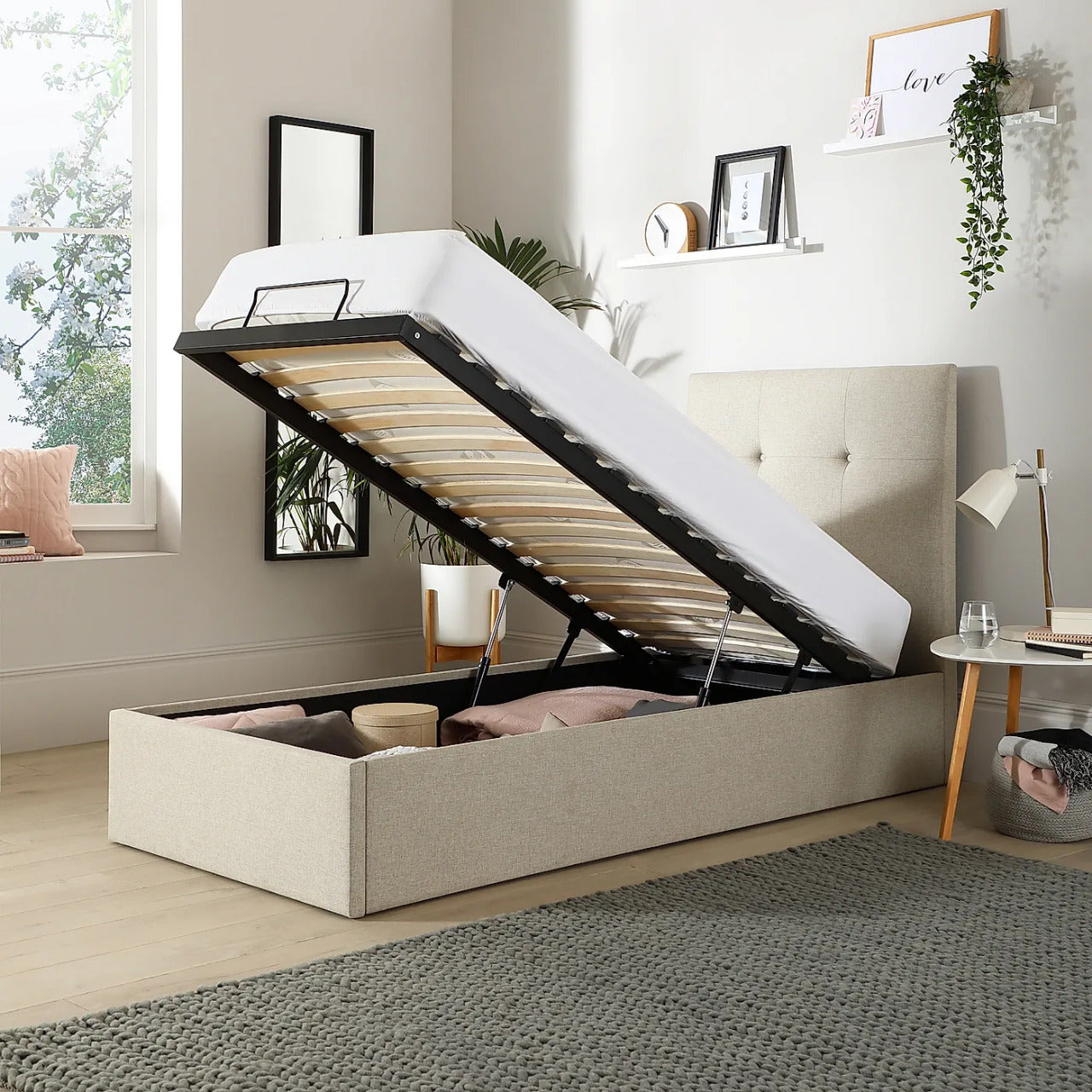 Single bed with lift up outlet storage